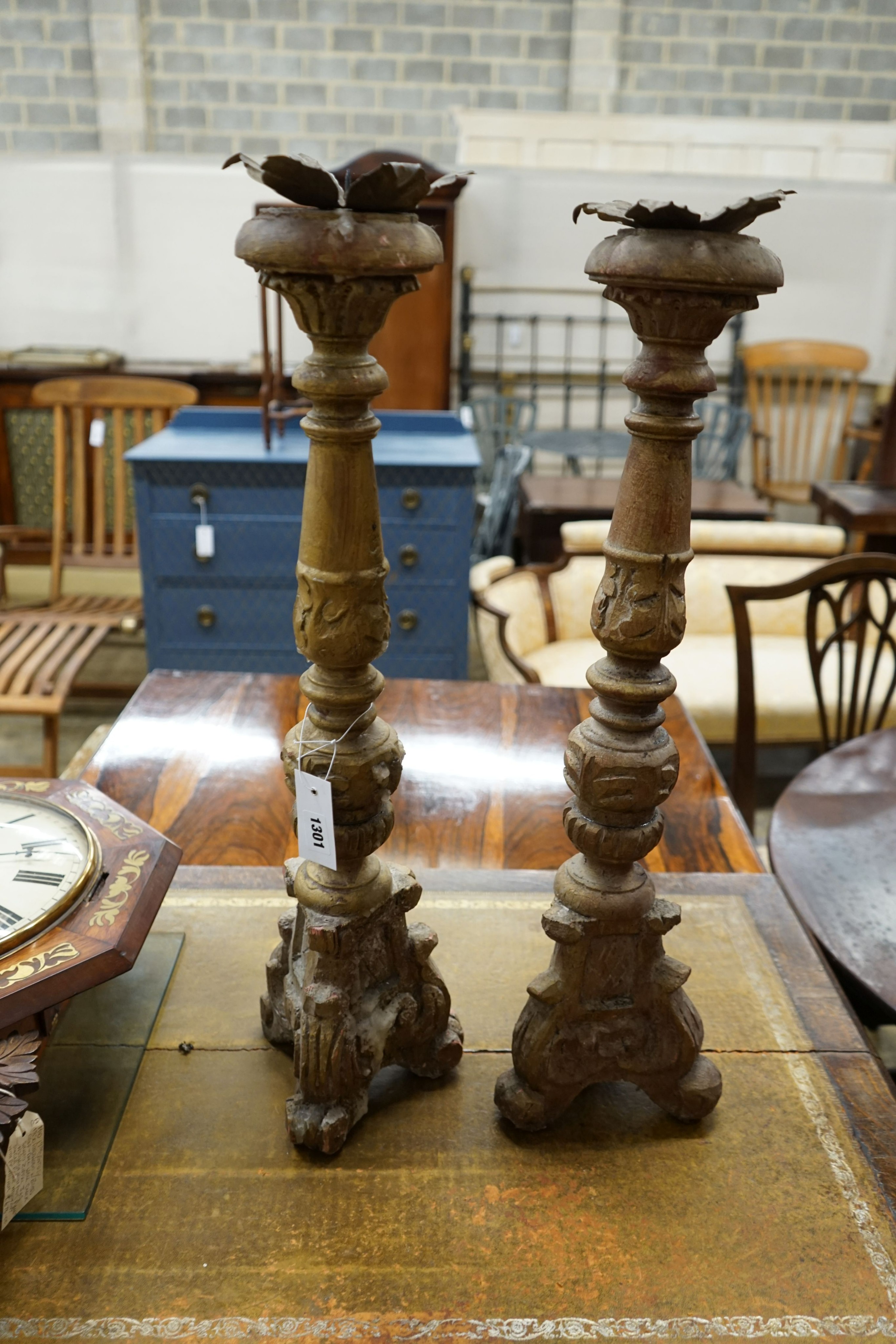 A pair of 18th century style carved giltwood pricket candlesticks, height 70cm